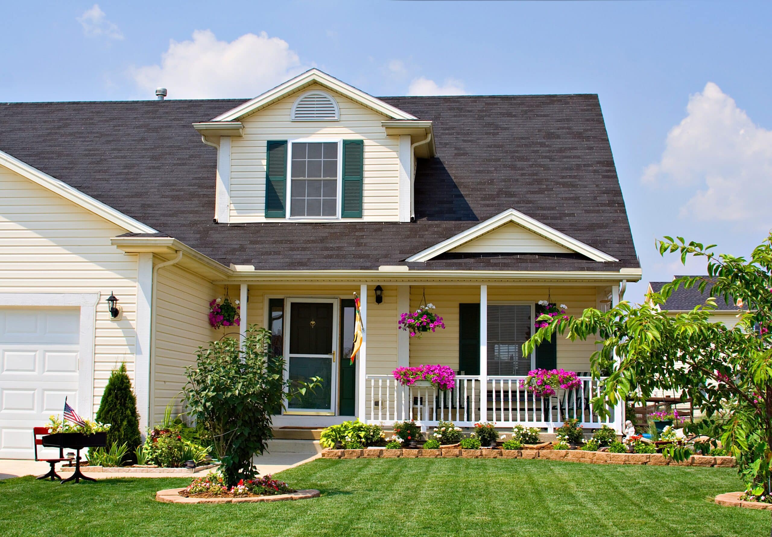 Single-family rental home exterior with a landscaped front yard and covered porch