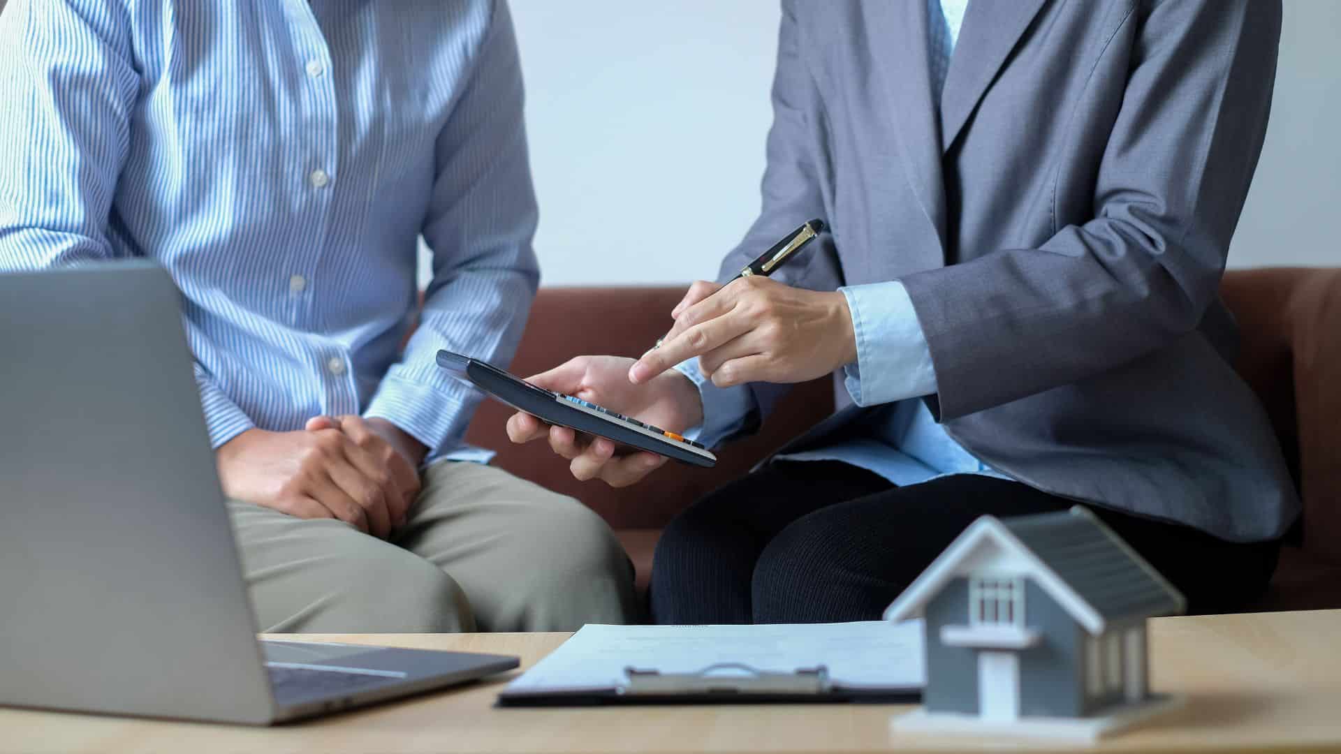 Property manager reviewing account details on a tablet with an Anniston owner