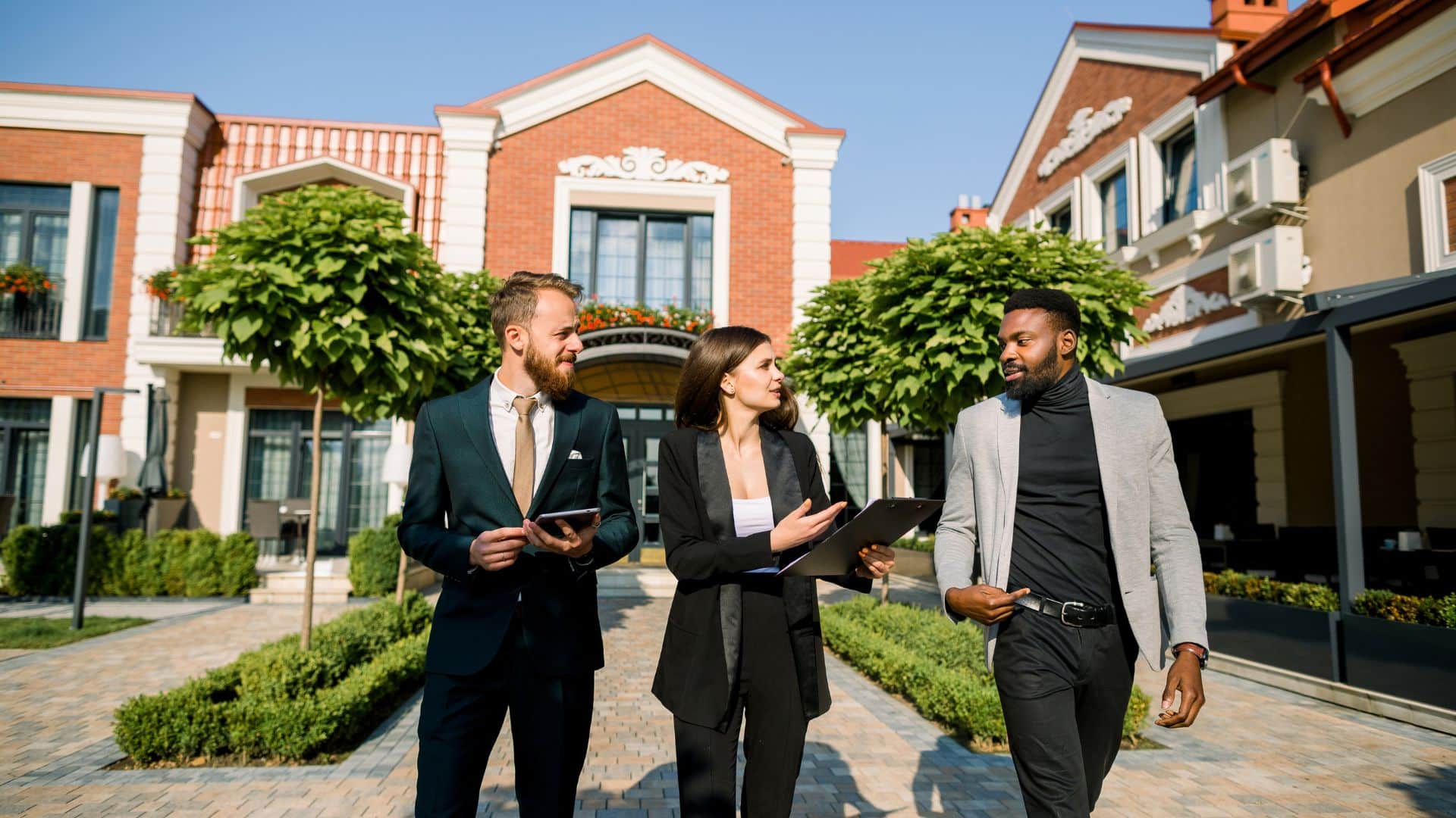 Property manager walking through a courtyard at a Center Point rental property