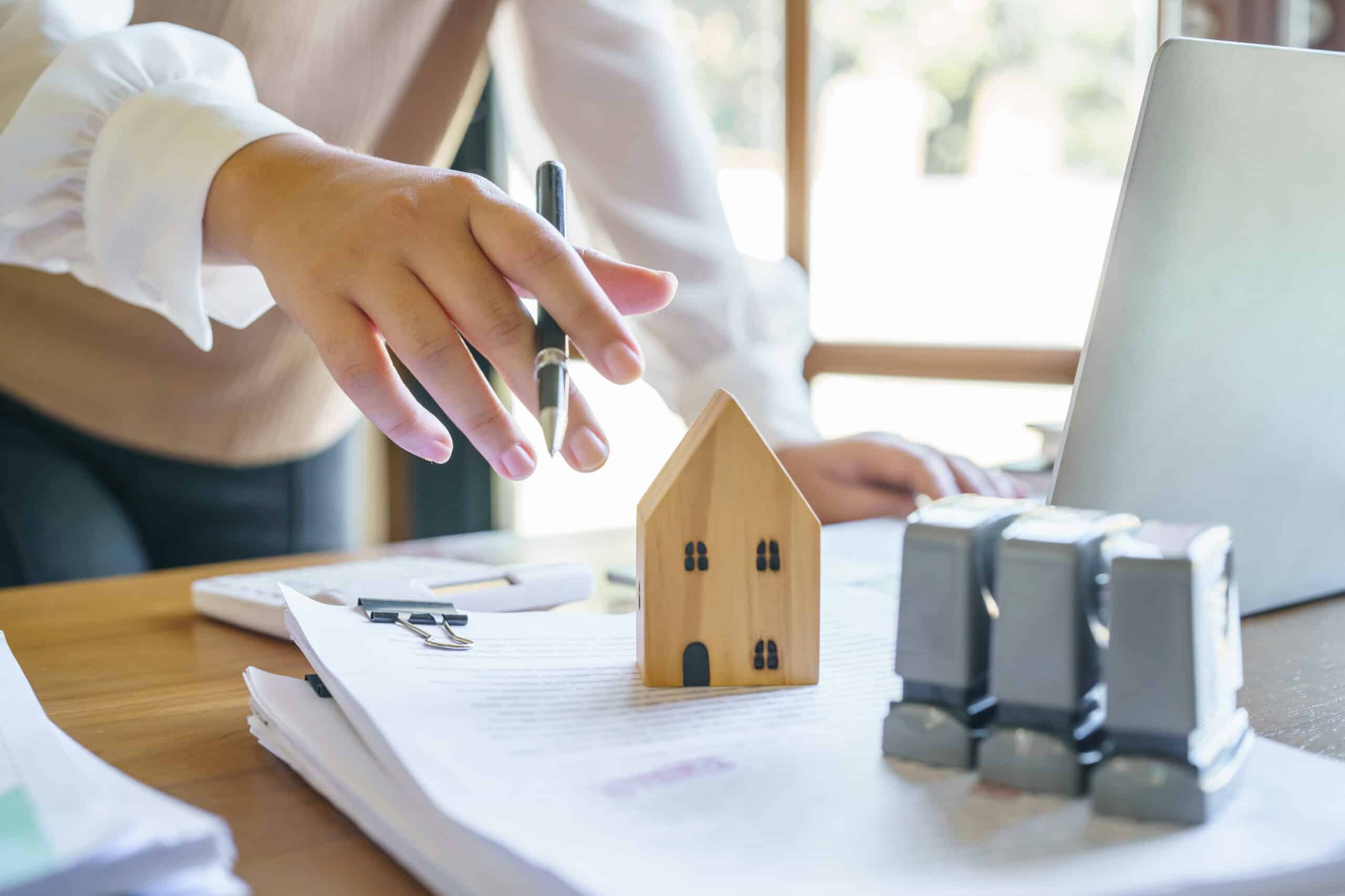 Property owner and property manager reviewing a signed lease agreement